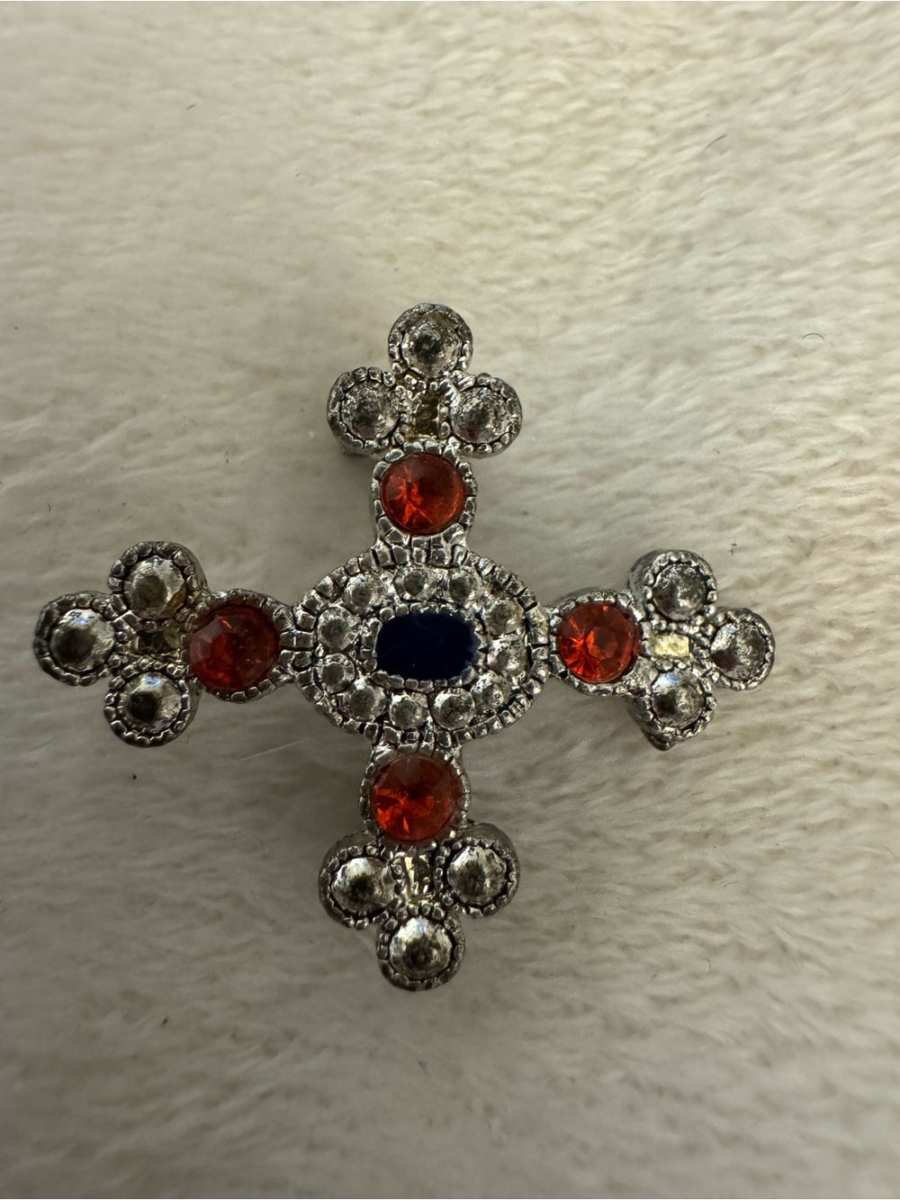 Vintage-Inspired Silver Cross Brooch with Red and Blue Stones